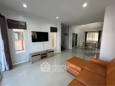 Spacious modern living room with sleek furniture and natural light