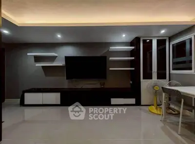 Modern living room with sleek TV unit and ambient lighting