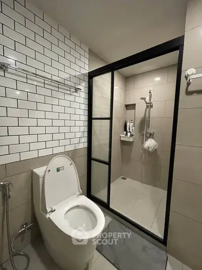 Modern bathroom with sleek shower and contemporary toilet design