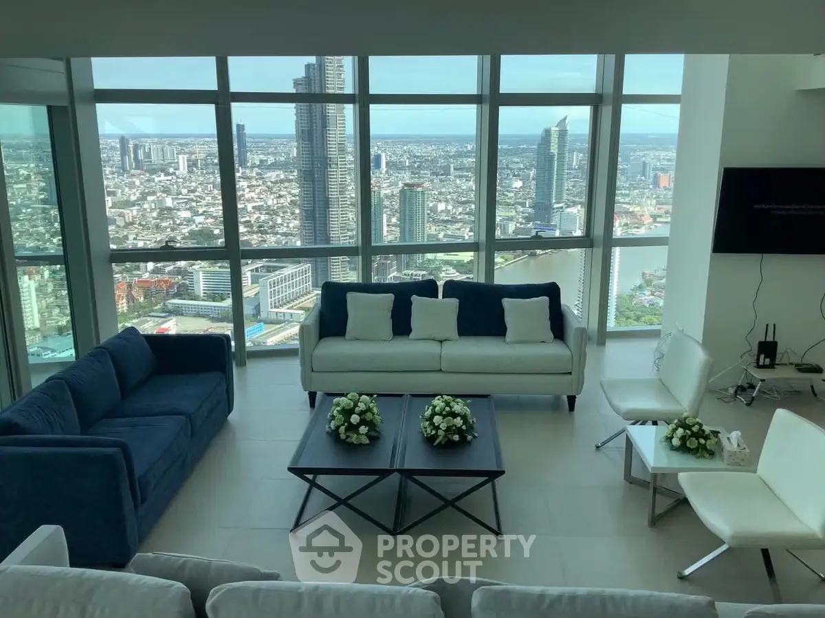 Luxurious high-rise living room with stunning city skyline view, modern furniture, and floor-to-ceiling windows.