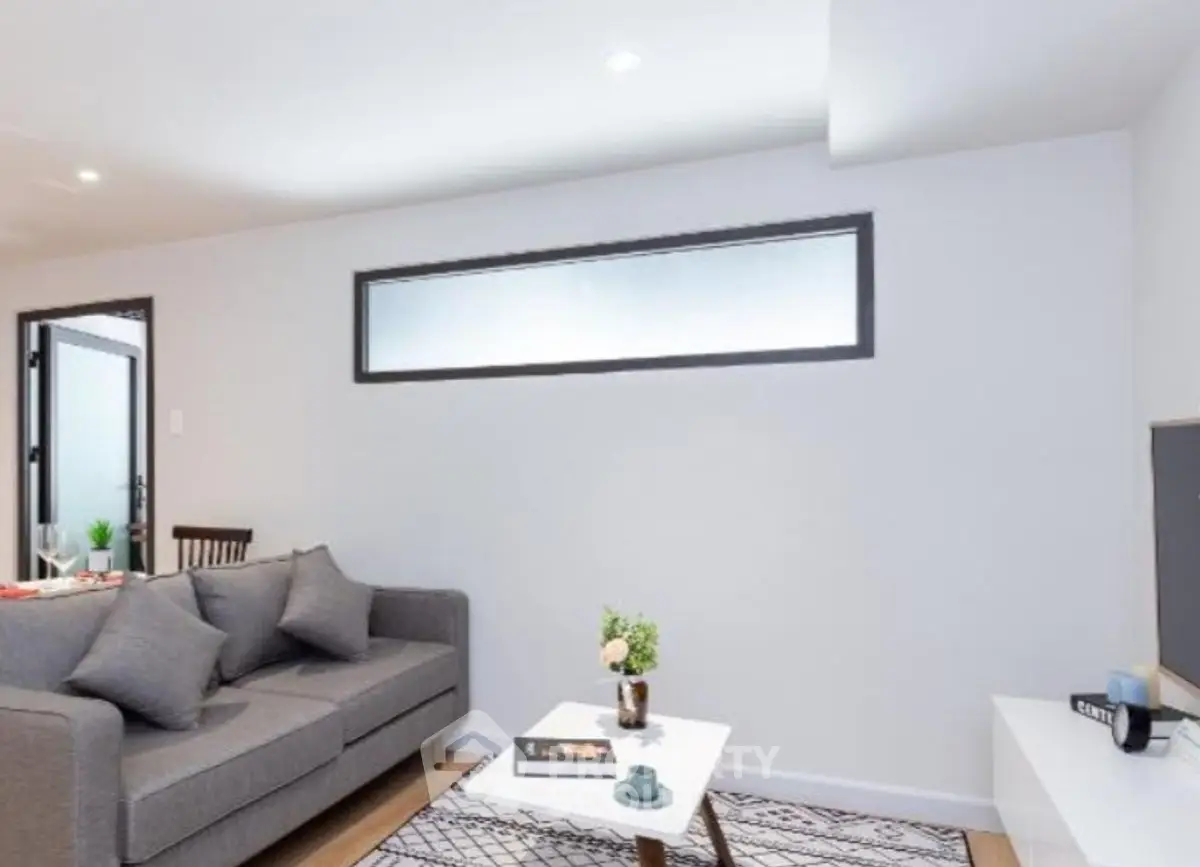 Modern living room with sleek furniture and minimalist decor