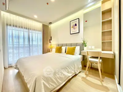 Modern bedroom with elegant decor, featuring a cozy bed, stylish artwork, and a functional study area.
