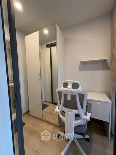 Modern study room with sleek white desk and ergonomic chair, perfect for productivity.