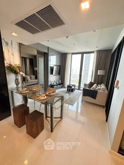 Modern living room with glass dining table and city view
