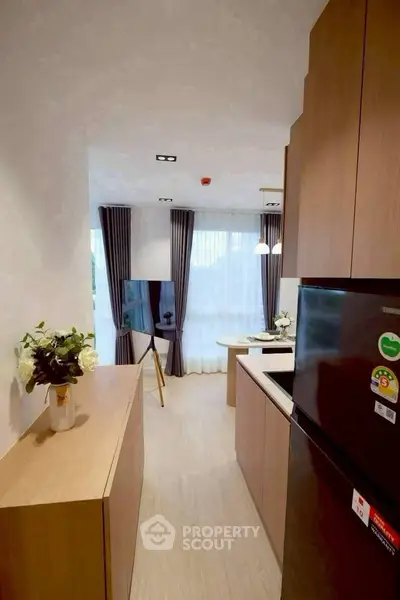 Modern kitchen with sleek design and open layout, featuring stylish cabinetry and contemporary appliances.