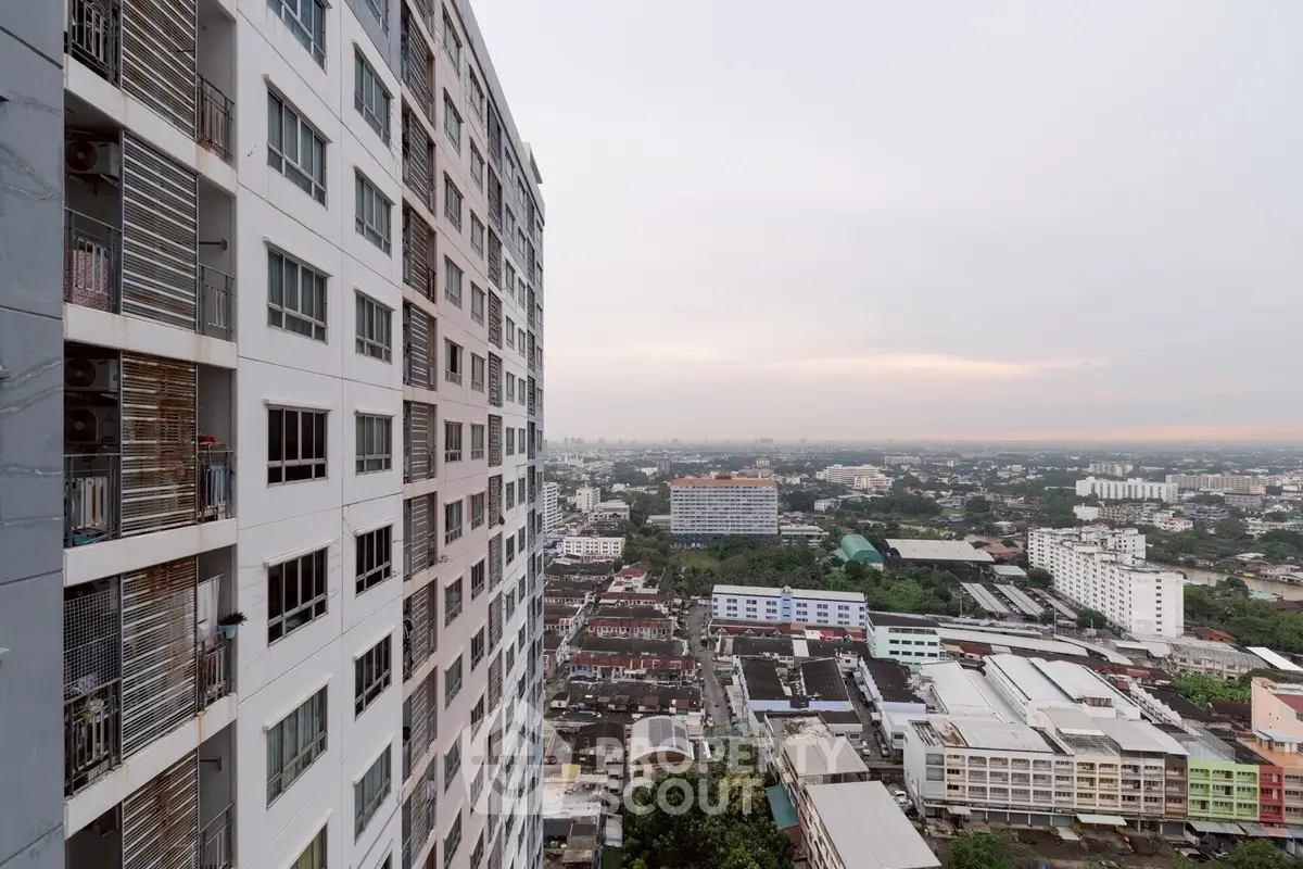 Stunning high-rise building with panoramic city views at sunset.