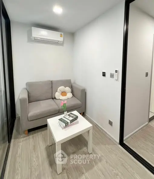 Cozy modern living room with grey sofa and minimalist decor