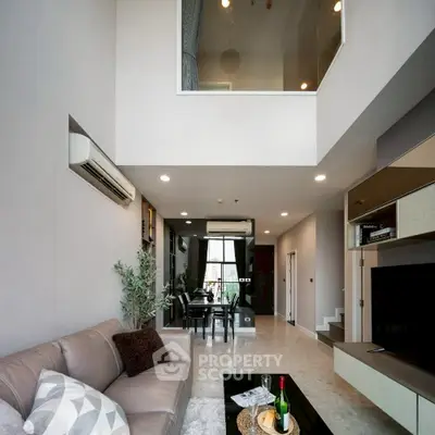 Spacious modern living room with high ceiling and elegant decor