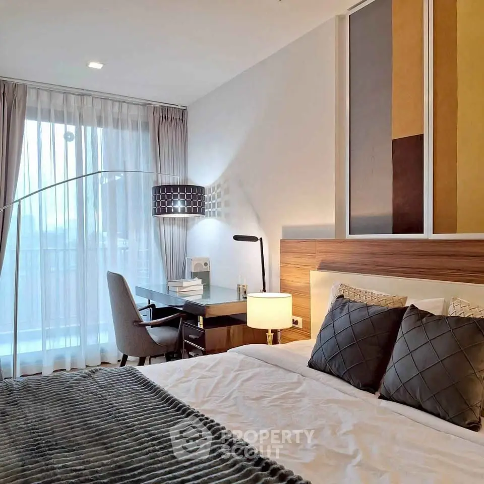 Modern bedroom with stylish decor and natural light