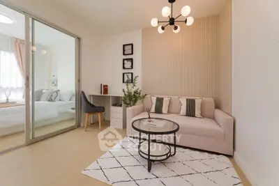 Modern living room with stylish decor and glass partition to bedroom