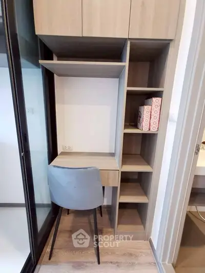 Compact study nook with modern shelving and chair in stylish apartment