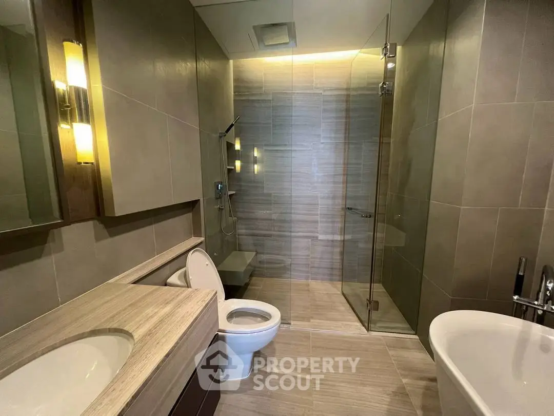 Luxurious modern bathroom with elegant fixtures and spacious shower area