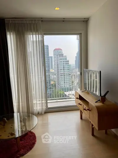 Modern living room with city view, featuring sleek furniture and large window for natural light.