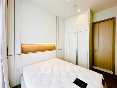 Modern bedroom with sleek built-in wardrobe and cozy lighting