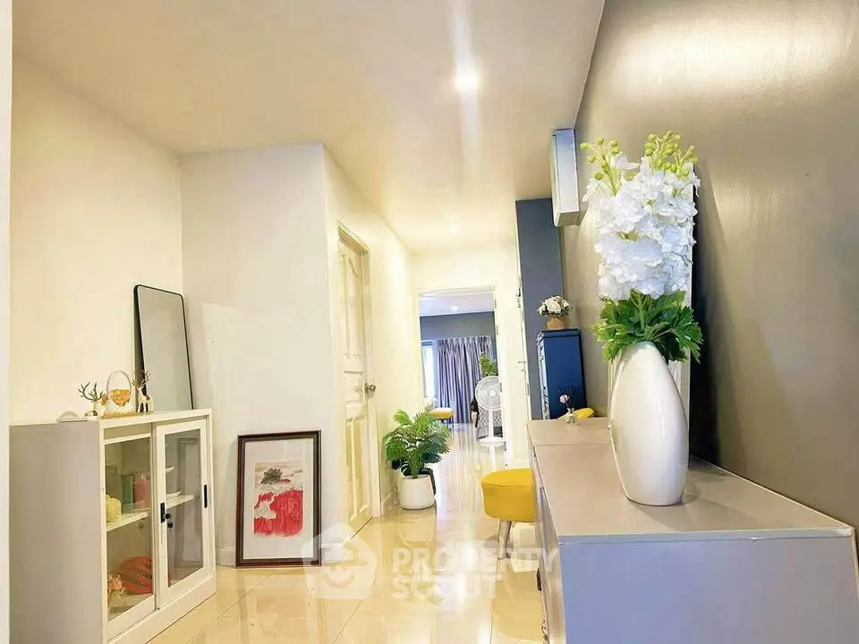 Stylish hallway with modern decor and bright lighting in a contemporary home interior.