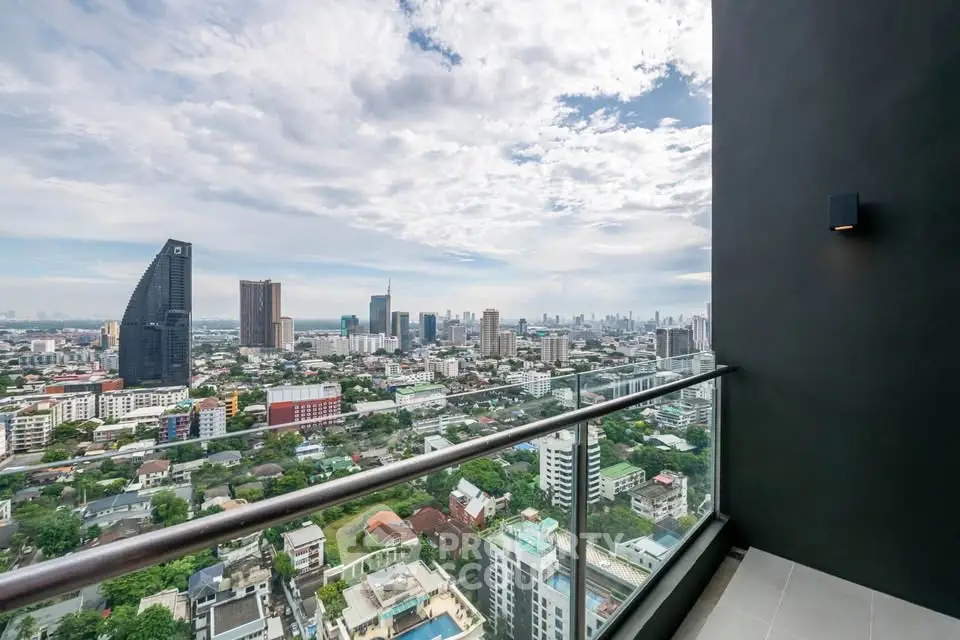 Stunning cityscape view from a modern high-rise balcony, perfect for urban living.