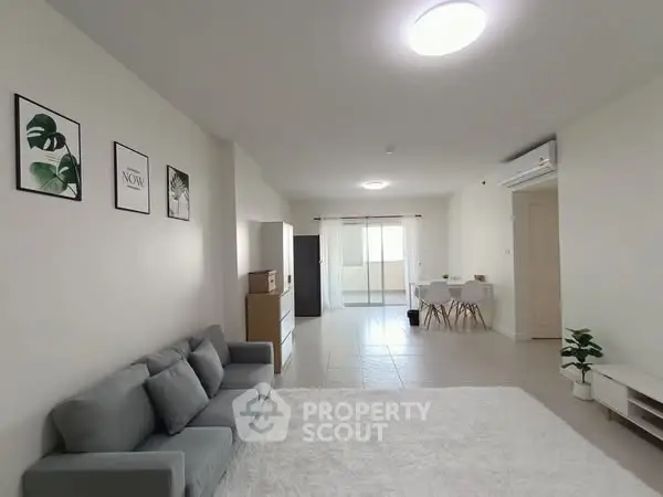 Spacious modern living room with cozy sofa and elegant decor