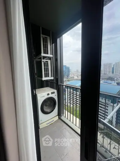 Modern balcony with city view and washing machine, ideal for urban living.