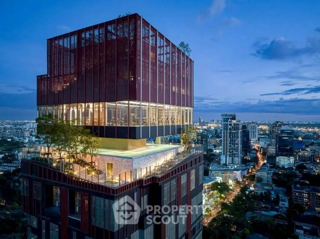 Stunning modern high-rise building with rooftop pool and panoramic city views at dusk.