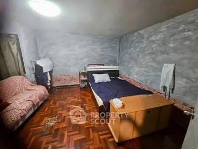 Cozy bedroom with wooden flooring and modern decor