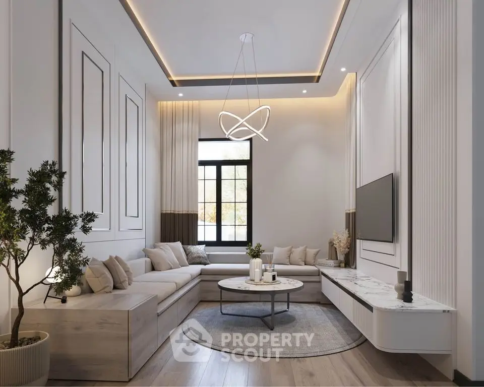 Elegant modern living room with stylish lighting and cozy seating area.