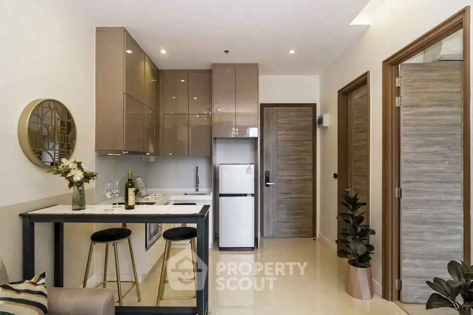 Modern kitchen with sleek cabinets and breakfast bar in a stylish apartment