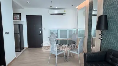 Modern living room with sleek furniture and stylish decor in a contemporary apartment.