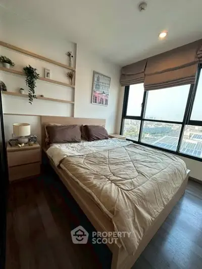 Cozy bedroom with large windows and stylish decor in modern apartment