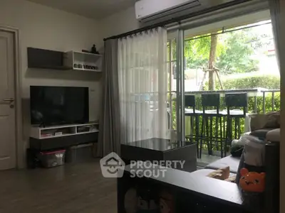 Cozy living room with balcony view and modern decor