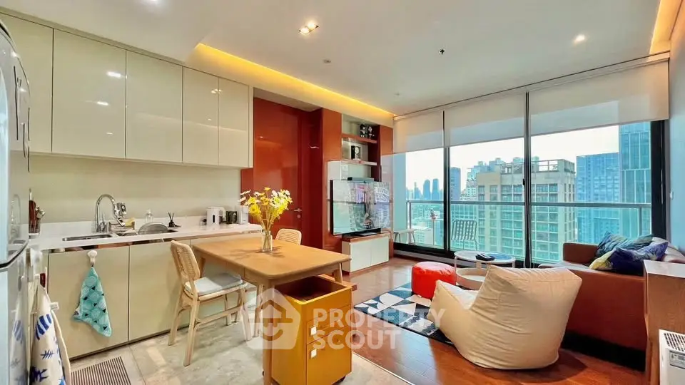 Modern open-layout kitchen and living room with city view and stylish decor