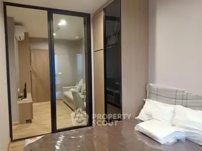 Modern bedroom with sliding glass doors and cozy interior design