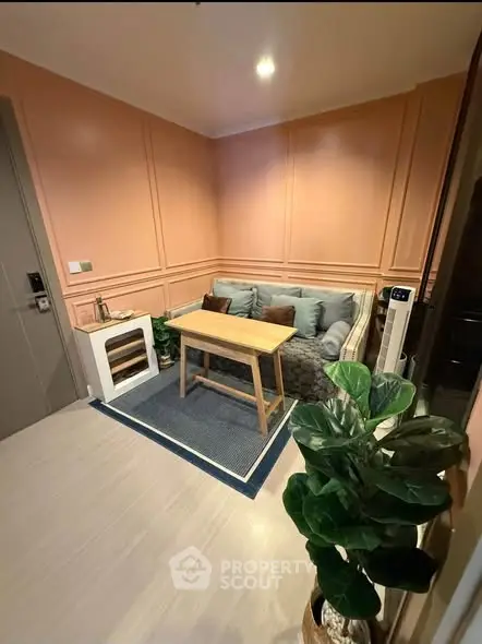 Cozy living room with stylish decor and comfortable seating in modern apartment.