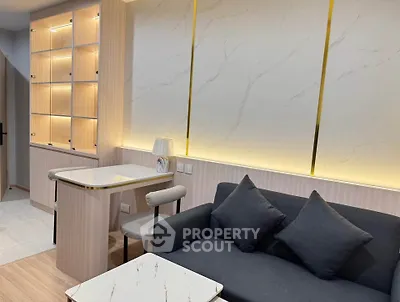Modern living room with elegant lighting and stylish furniture