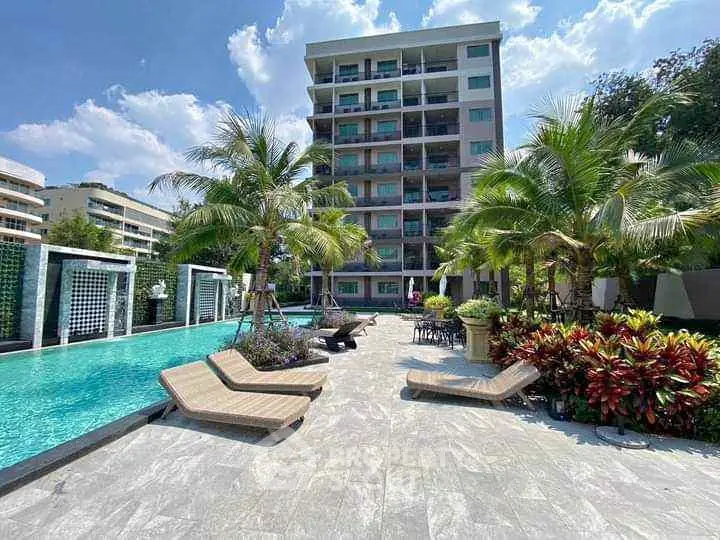 Luxurious condo with poolside view and lush greenery, perfect for relaxation and modern living.