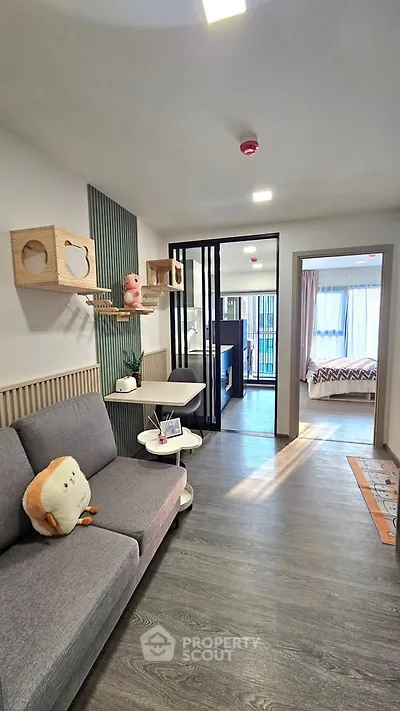 Modern living room with stylish decor and cozy ambiance, featuring a plush sofa and unique wall shelves.