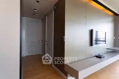 Modern living room with sleek TV setup and ambient lighting