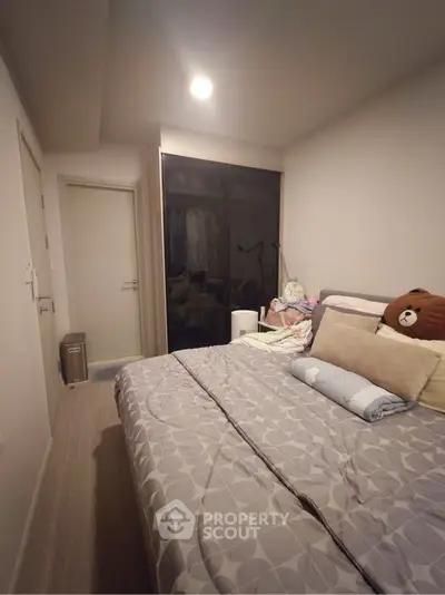 Cozy bedroom with modern decor and ample storage space