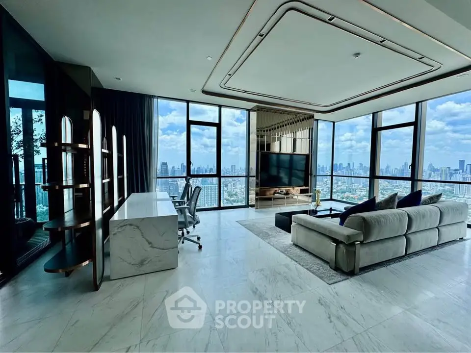 Luxurious high-rise living room with panoramic city views and modern furnishings.
