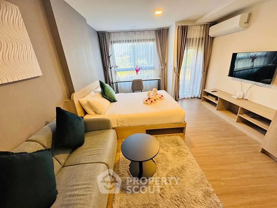 Modern studio apartment with cozy living area and stylish decor