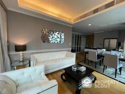 Luxurious living room with elegant decor and modern kitchen in open layout apartment