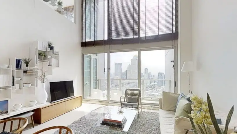 Modern living room with large windows and city view