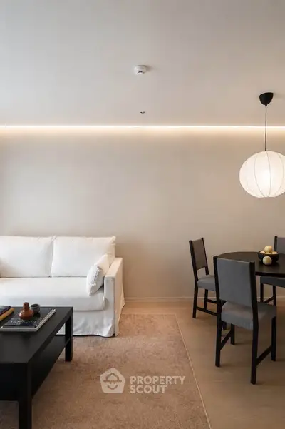 Modern living room with sleek furniture and ambient lighting