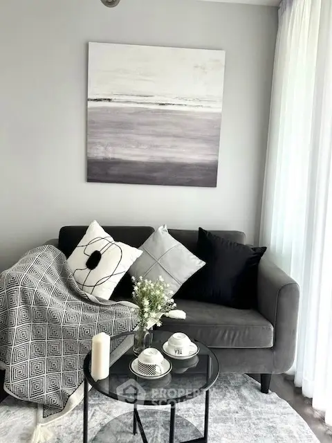Chic living room with modern decor, cozy sofa, and elegant coffee table setup.