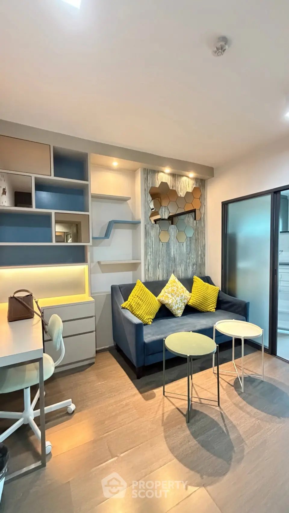 Modern living room with stylish decor and cozy seating area, perfect for relaxation and entertaining.
