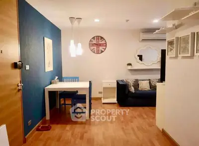 Charming living room with modern decor and cozy seating area, perfect for relaxation.