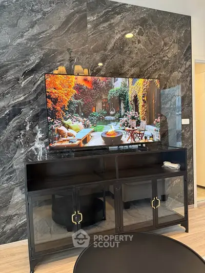 Luxurious living room with elegant marble wall and modern TV setup