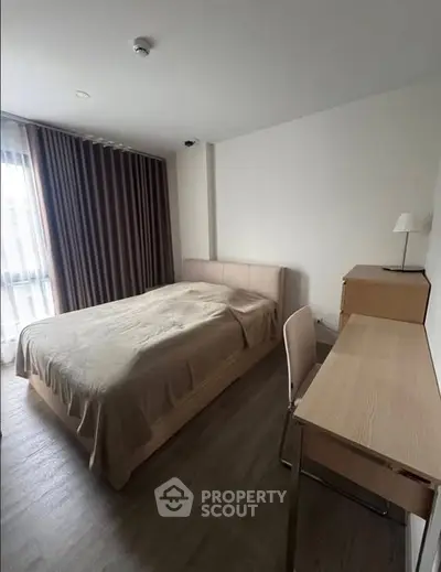 Cozy bedroom with modern furnishings and natural light