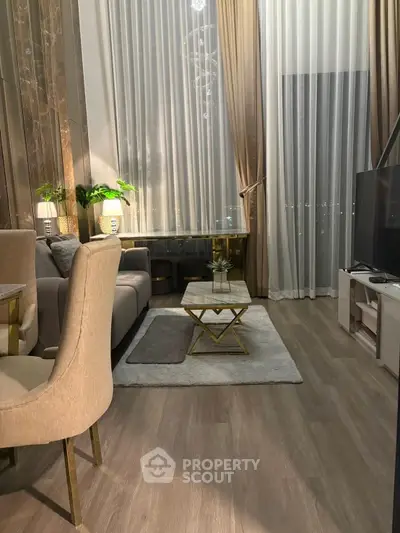 Luxurious living room with high ceilings and elegant decor