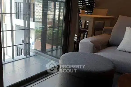 Modern living room with balcony view in urban apartment
