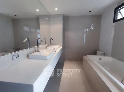 Luxurious modern bathroom with dual sinks and spacious bathtub